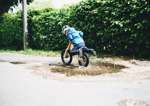 A child on a small bicycle