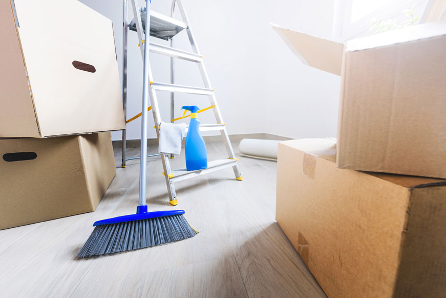 Cleaning supplies, a step ladder, and moving boxes