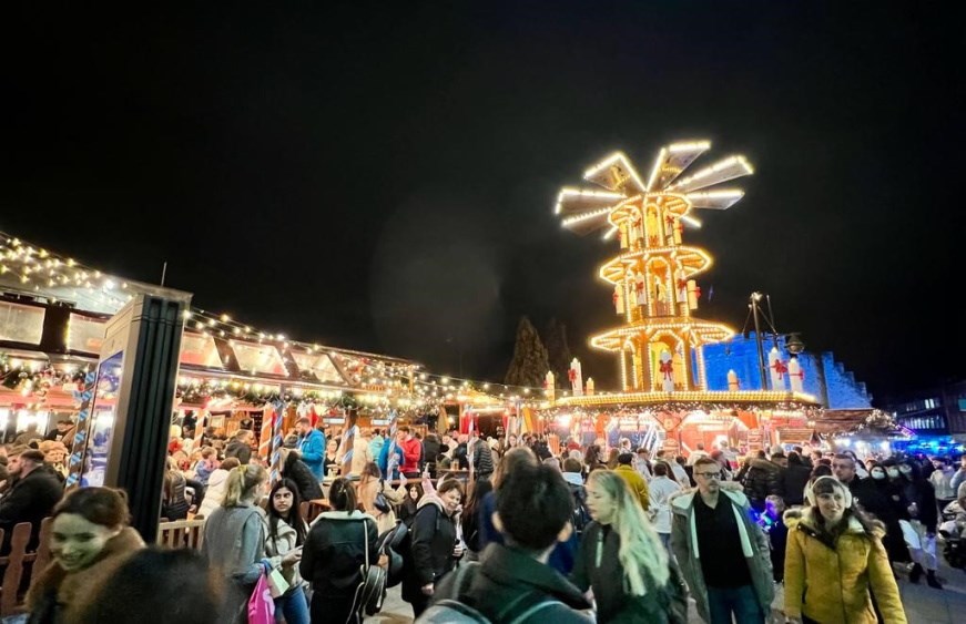 Southampton Christmas Market at night with many people in attendance