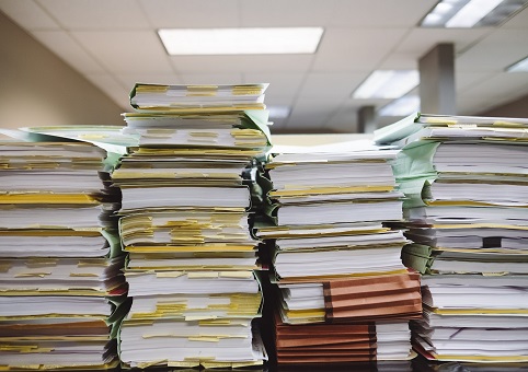 Heavy stacks of files and documents