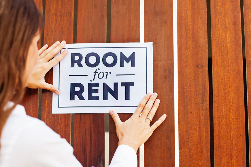 Someone Putting Up A Room For Rent Sign