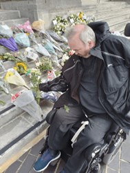 Andrew laying flowers at The Civic Centre