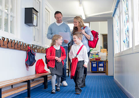 Family walking in a school