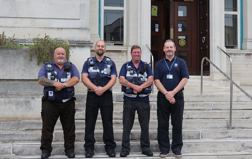 Four City Welfare Wardens on steps outside Southampton Civic Centre