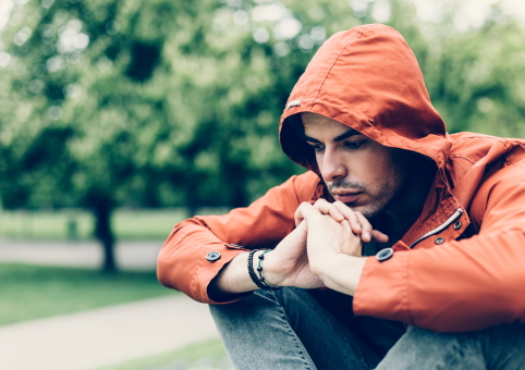 Young man looked worried in park