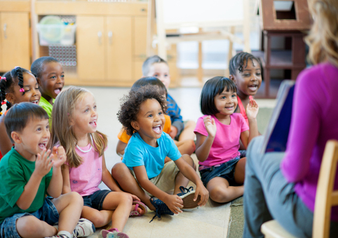 Children being shown a picture book