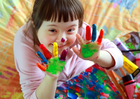 Child with paint on hands