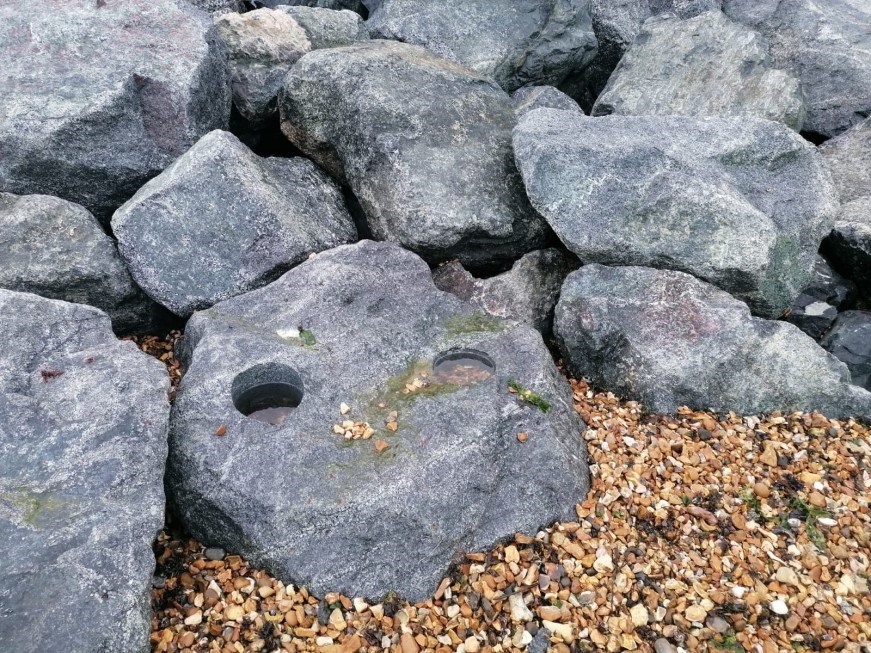 Rock pools drilled into lower rocks to help the marine environment thrive