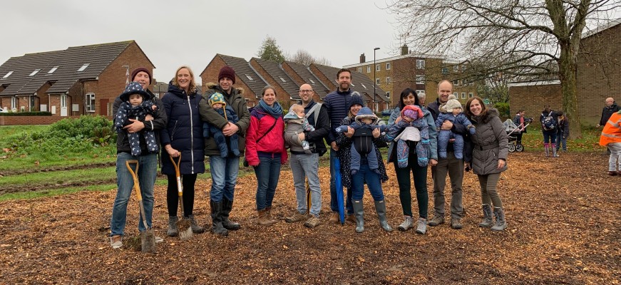 Group of people gathered to plant a tree for life