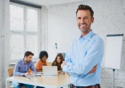 A smiling teacher in a classroom