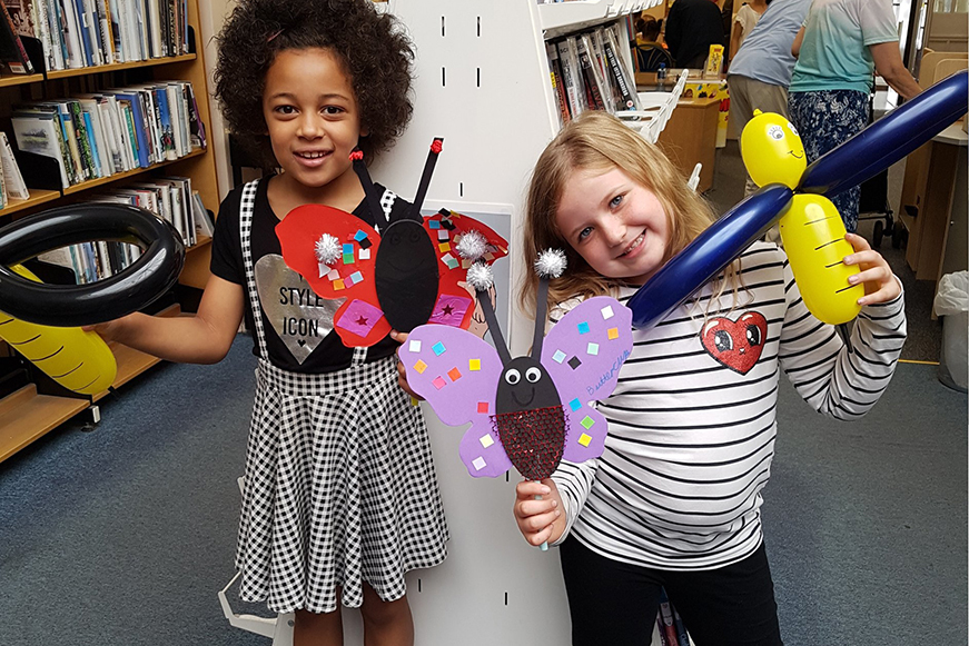 Two children having fun at the library Two children having fun at the library