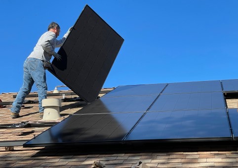 Person installing solar panels