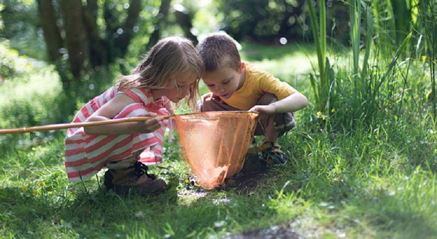 Young children holding fishing net