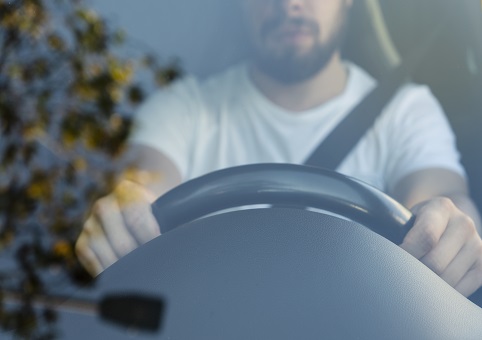 Man behind steering wheel