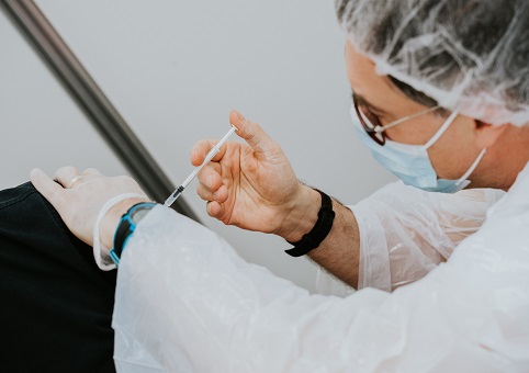 A doctor giving an injection