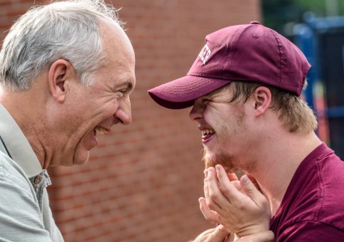 An older man with a younger man who has Down's Syndrome