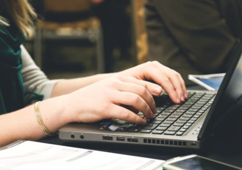 Person typing on a laptop