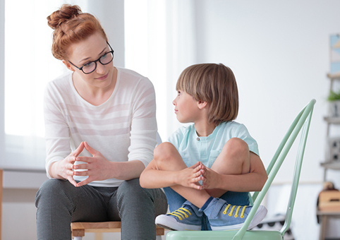 A child speaking to a professional