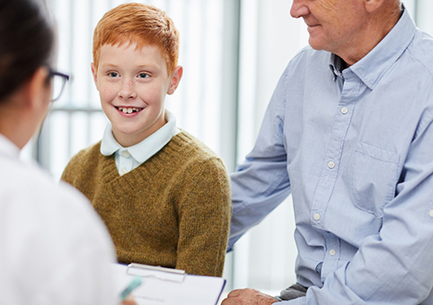 A boy and a man attending a medical appointment