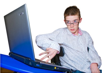 Young person looking at a laptop