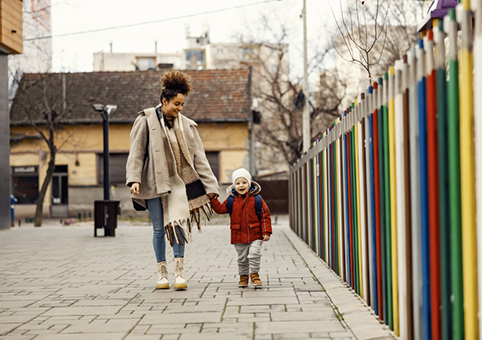 Parent walking with child outside