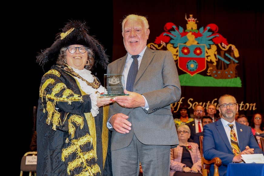 Archie Parsons receives his award from outgoing Lord Mayor Rayment