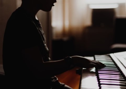 Student playing the piano