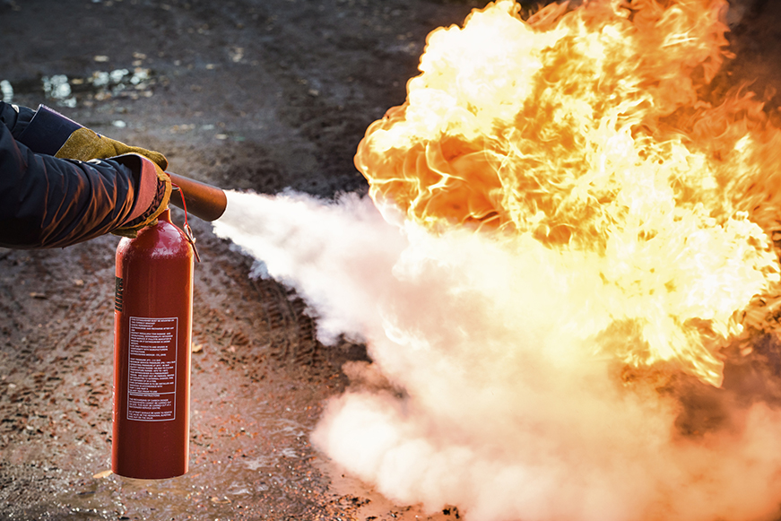 Fire extinguisher being used on a fire