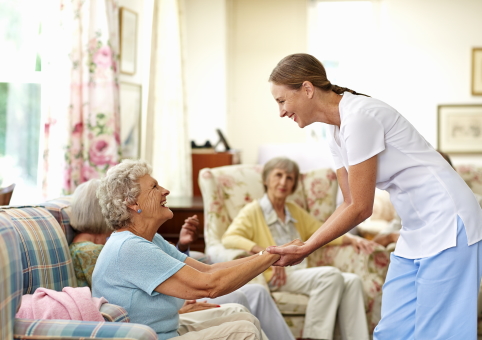 Elderly woman being looked after in care home