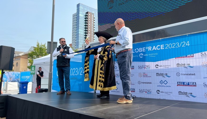 Lord Mayor Laurent cutting the ribbon to open the Race Village