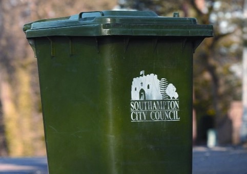 A green-lidded general waste bin with Southampton City Council markings