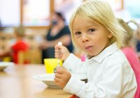 Child eating school meal