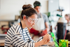 Student with goggles in school lab