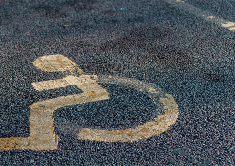 Faded disabled bay road marking
