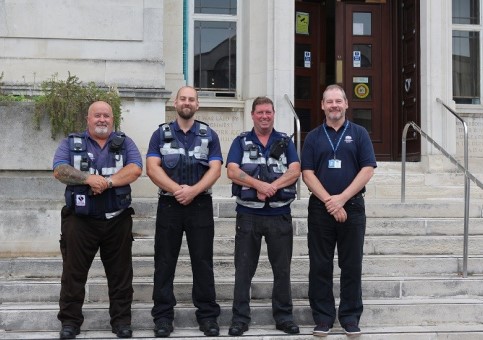 Four City Welfare Wardens on steps outside Southampton Civic Centre