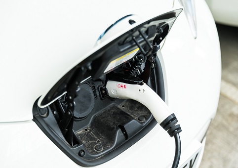 An electric vehicle being charged