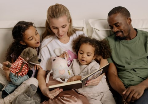 Family reading a book together