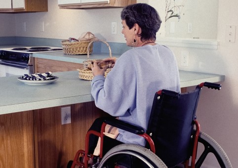 Woman in a wheelchair in the kitchen