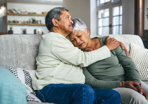 Man consoling upset partner