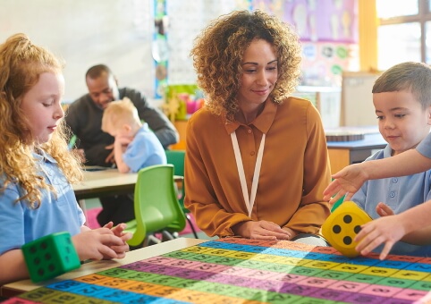 Woman and pupils in classroom