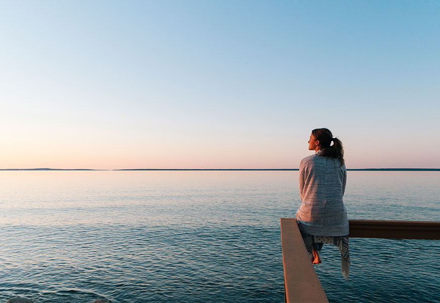 Someone looking out to sea