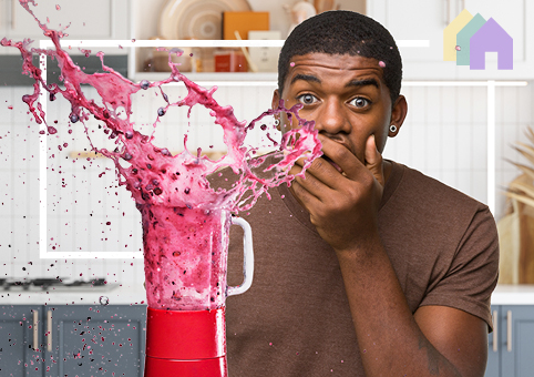 Young adult using blender with lid off