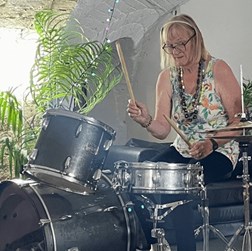 Photo of Carol on drums