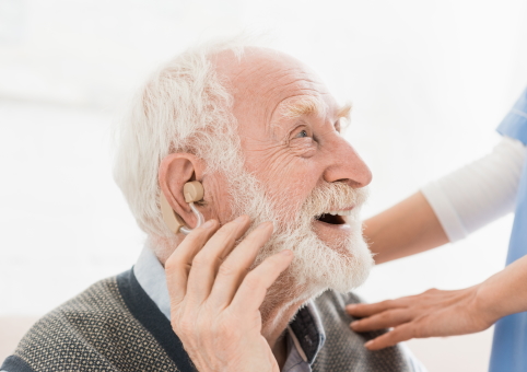 Elderly man with hearing aid