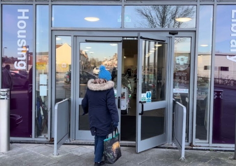 Woman walking into library