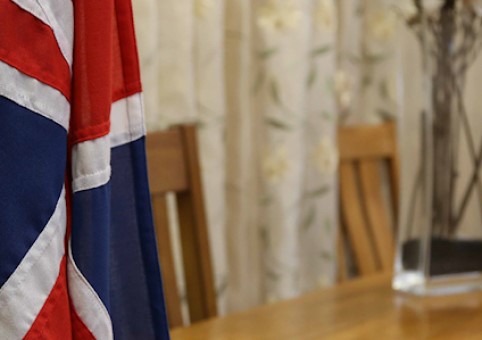 A Union Jack flag in front of a desk