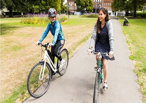 Two cyclists on a park path