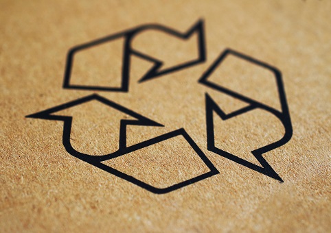 Recycling symbol printed on brown cardboard