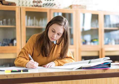 An older student studying at a desk