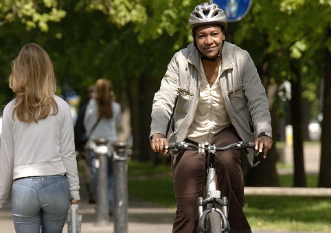 Cyclist passing pedestrians on a path